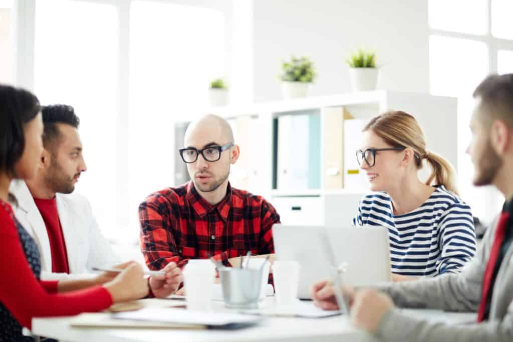 A small group of clients attending a meeting about the office relocation